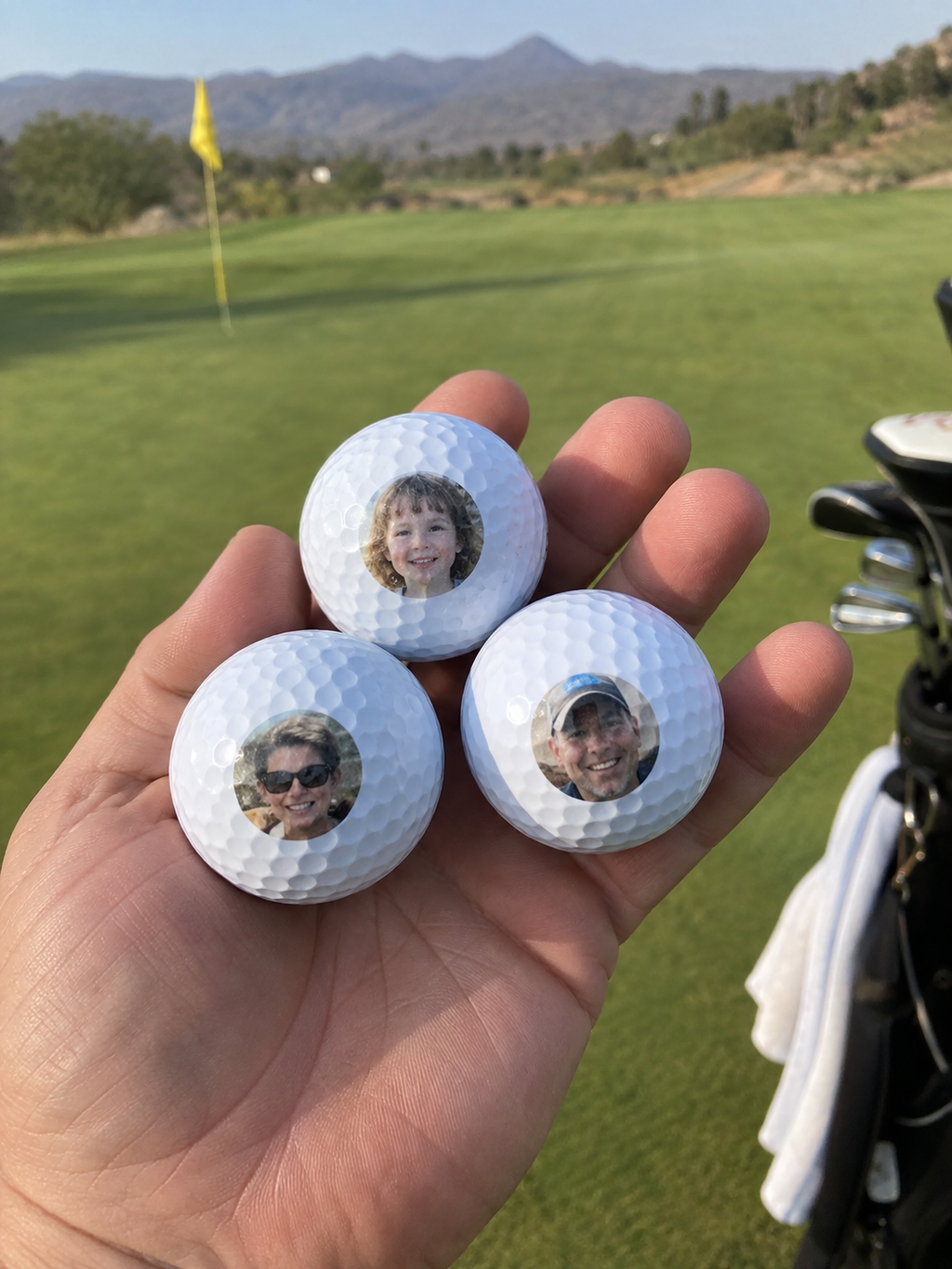 Three golf balls with tiny personal portraits