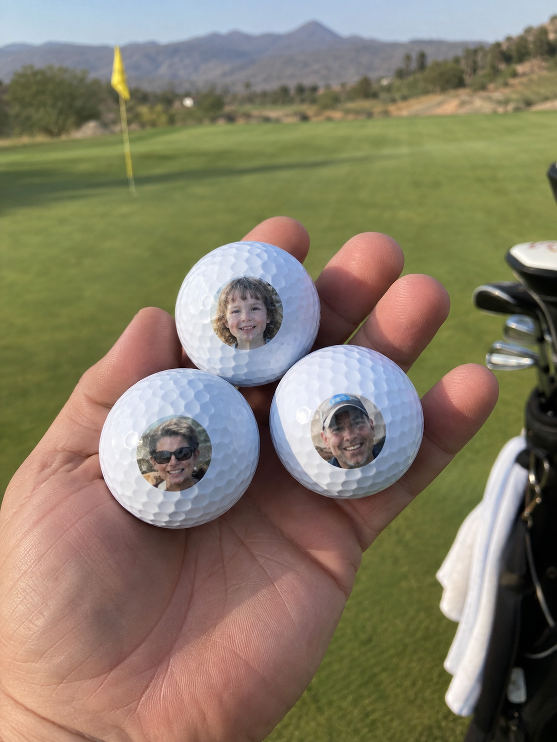 Three golf balls with tiny personal portraits