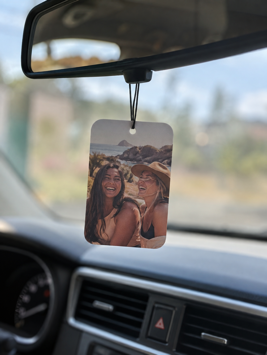 Car air freshener printed with a friends road trip photo