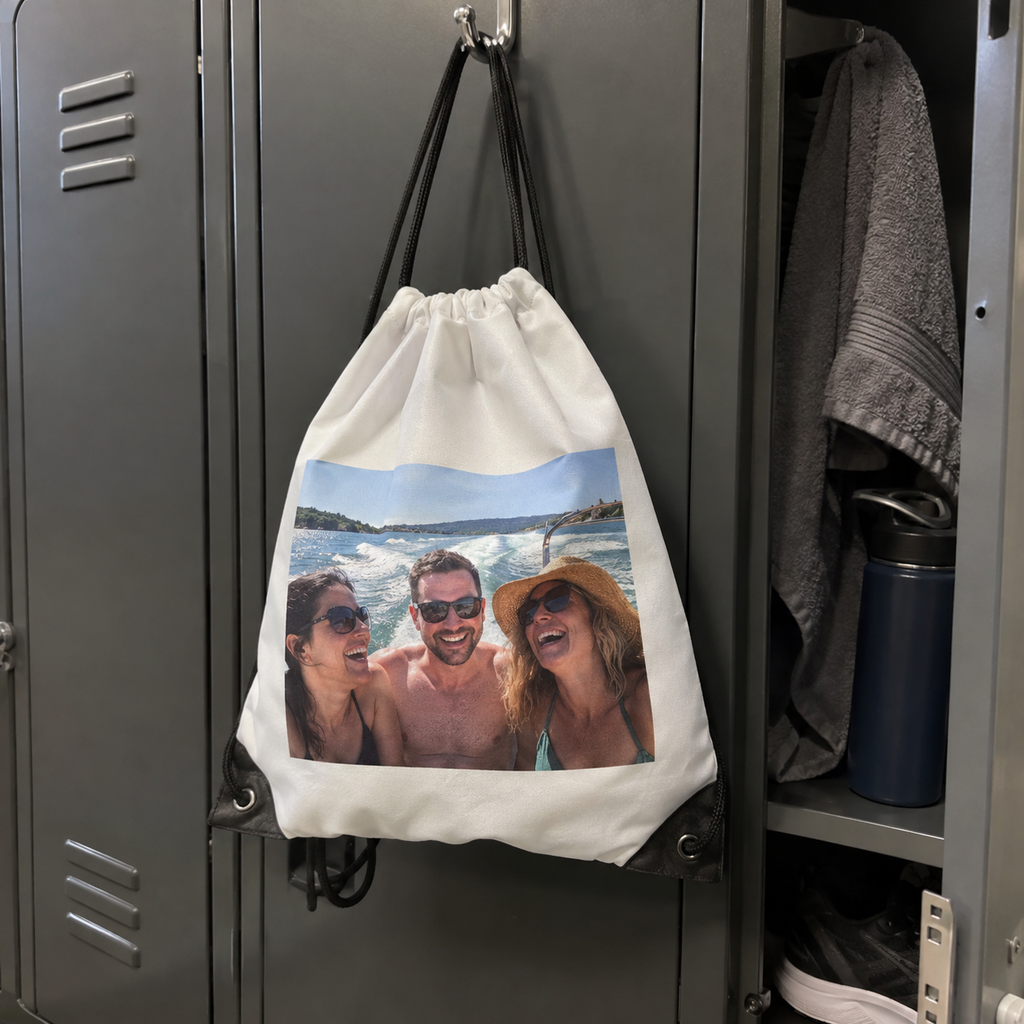 A drawstring bag printed with an old boat trip photo, used at a gym.