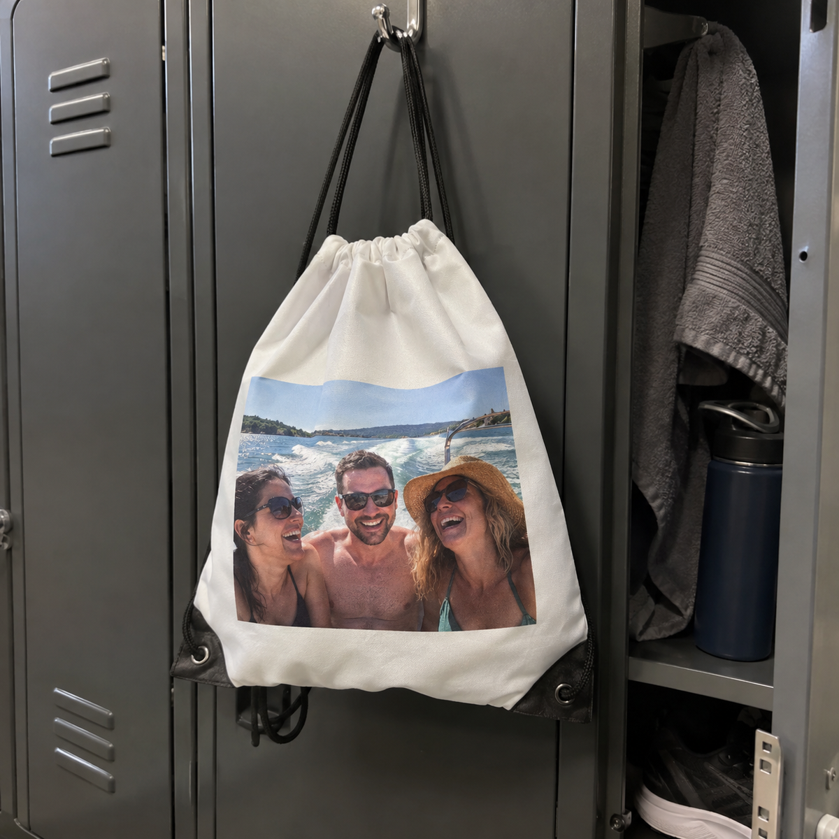 A drawstring bag printed with an old boat trip photo, used at a gym.