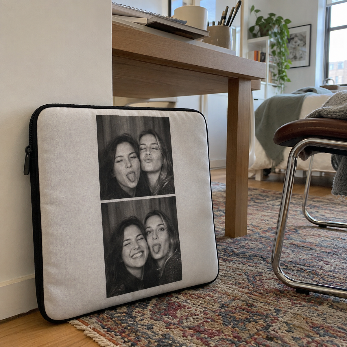 A laptop sleeve printed with an old friends photo in a casual setting.