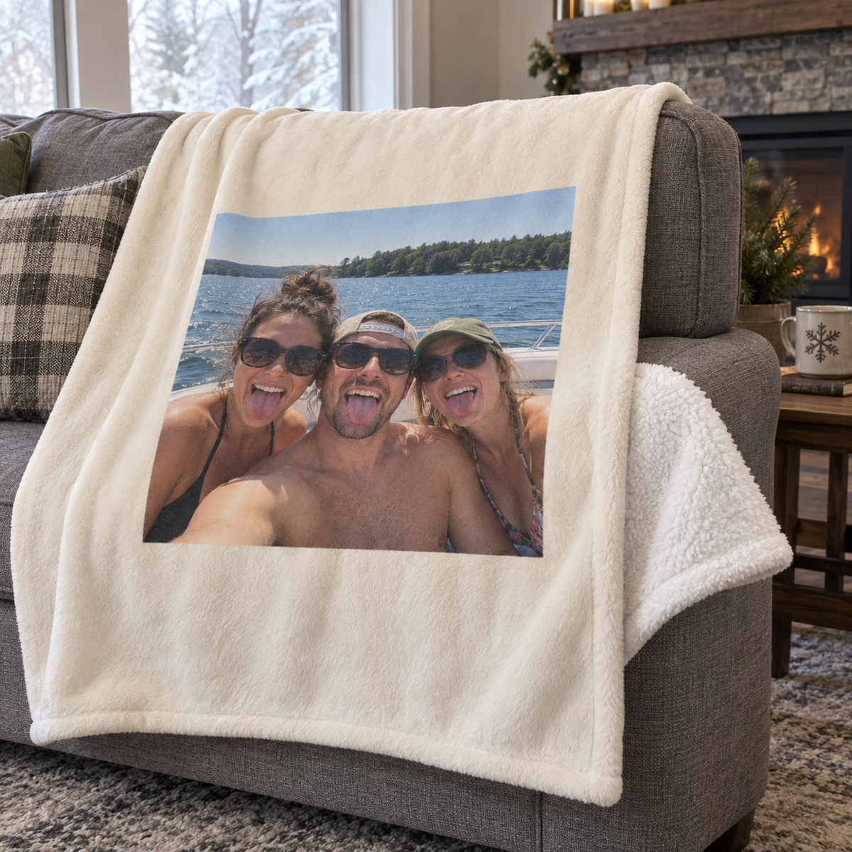 A plush personalized blanket with a bounded photo of friends on a sunny boat trip, draped over a sofa.