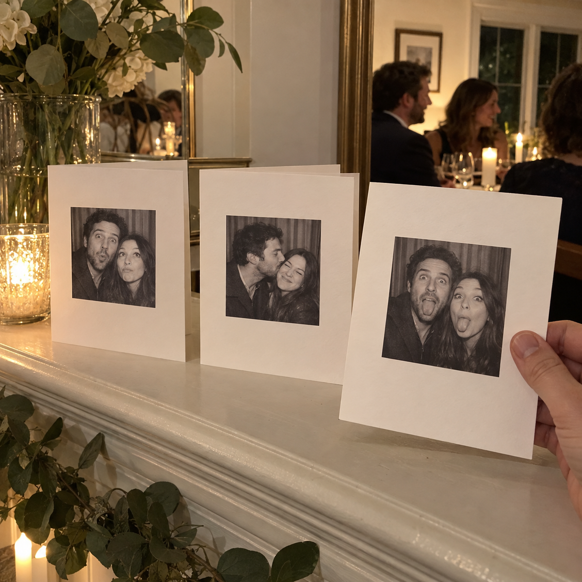 Folded greeting cards printed with funny couple photo booth portraits.