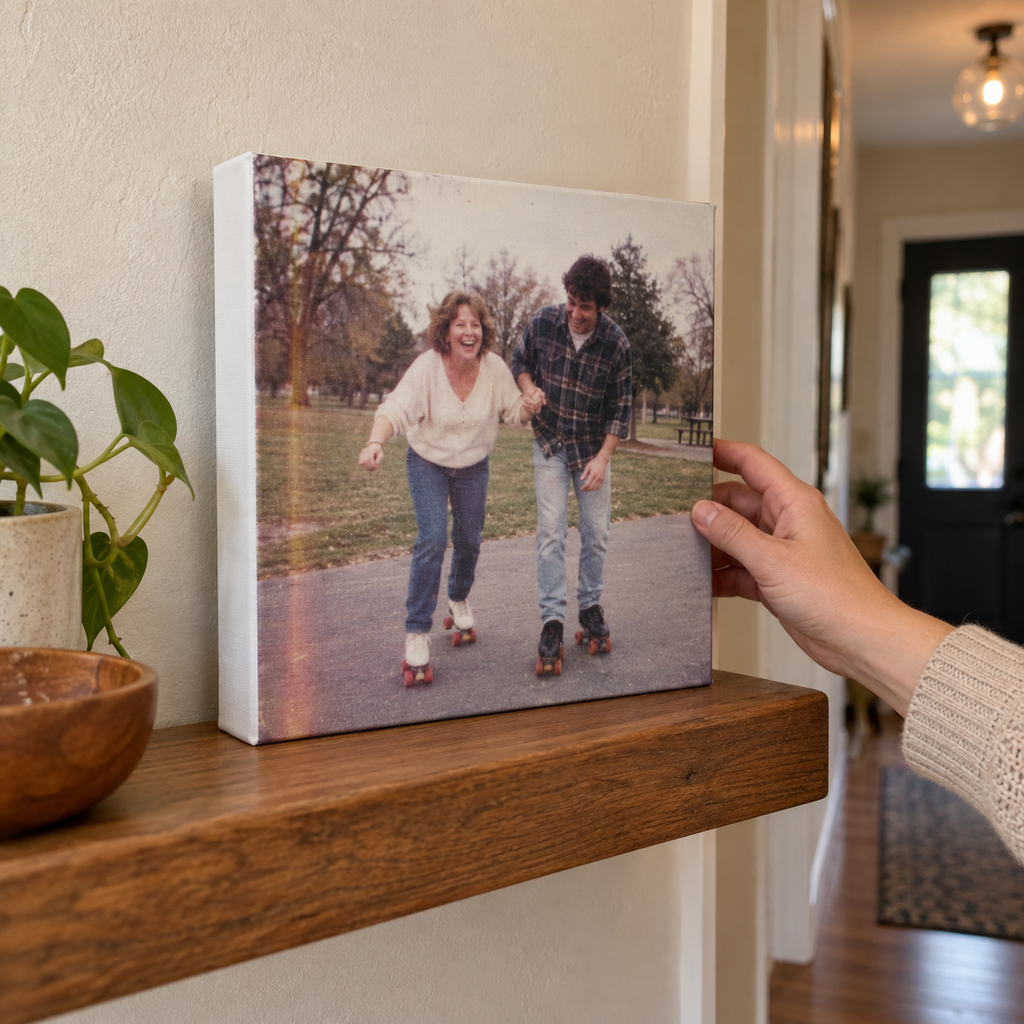 A gallery canvas print with an old photo of mother and son roller skating at home.