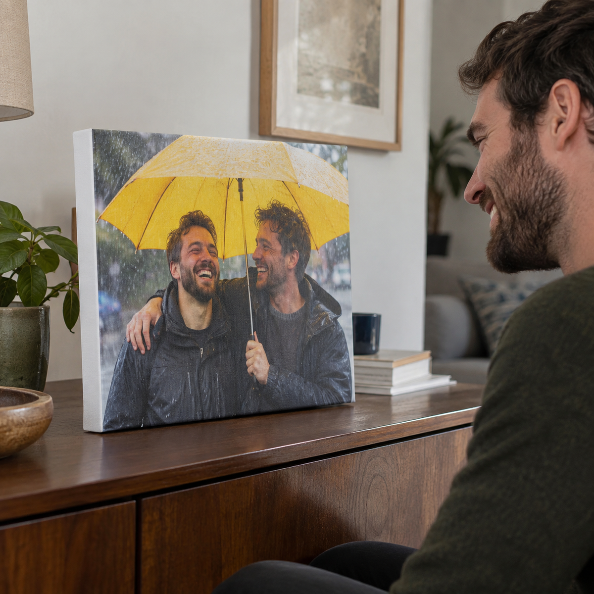 A wrapped canvas print of two brothers laughing under a yellow umbrella.
