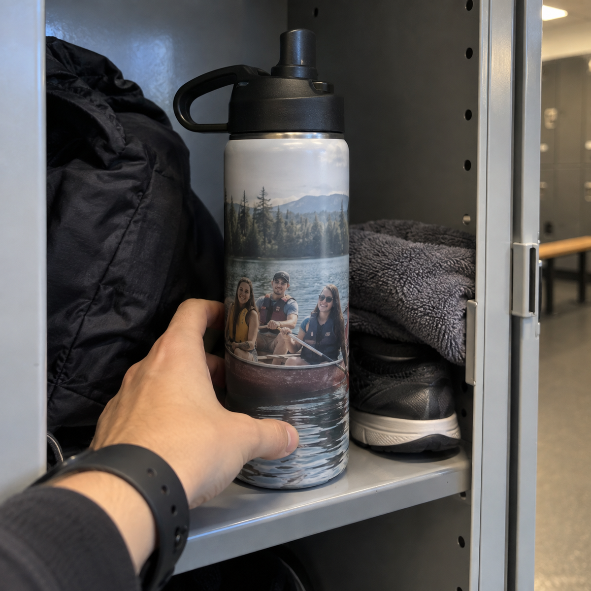 Sports bottle printed with a past canoe trip photo in a gym locker.