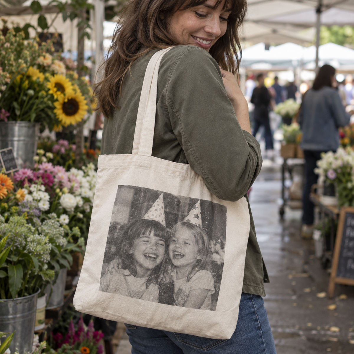 An organic cotton tote printed with a childhood birthday photo at a flower market.