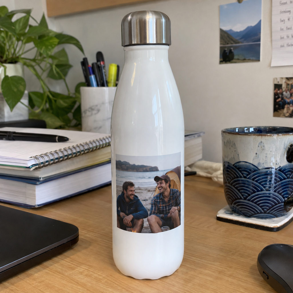 A slim water bottle printed with an old beach photo of two brothers.