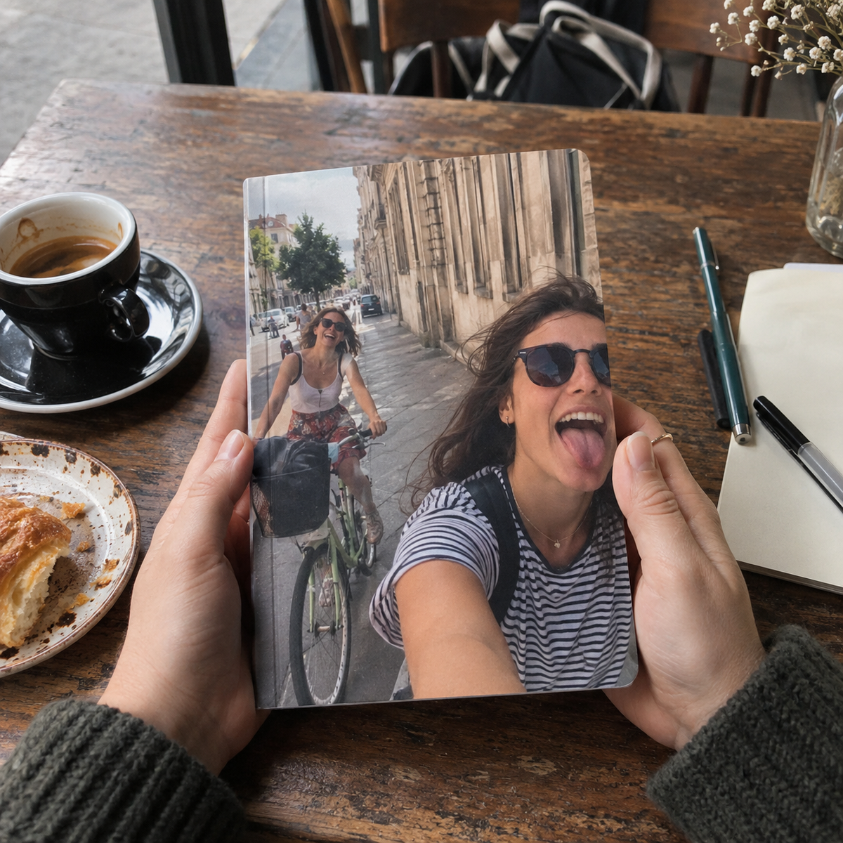 A5 notebook with a friends' cycling selfie printed on its cover.