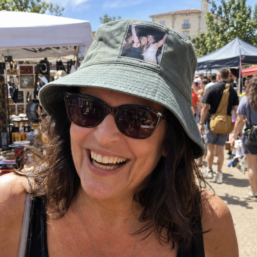 Bucket hat with a small printed photo of friends dancing.