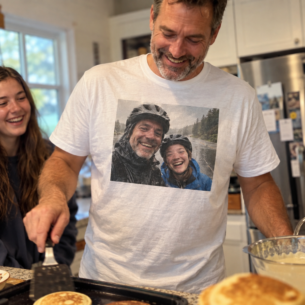 Father and teenage daughter on a white T-shirt photo print in their kitchen.