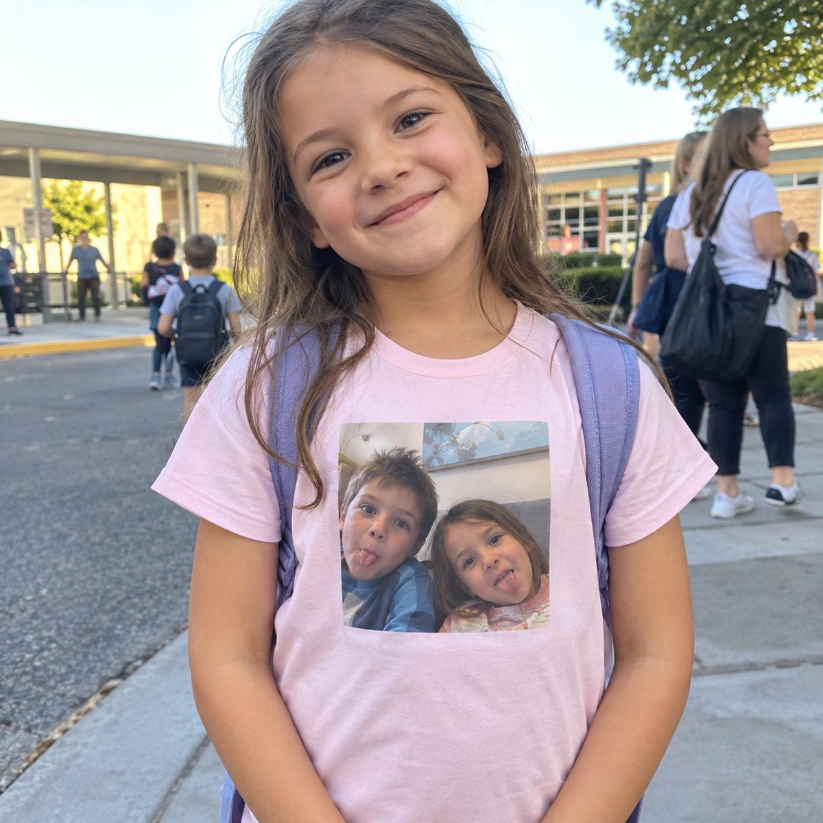 Child wearing a T-shirt printed with a playful family photo.