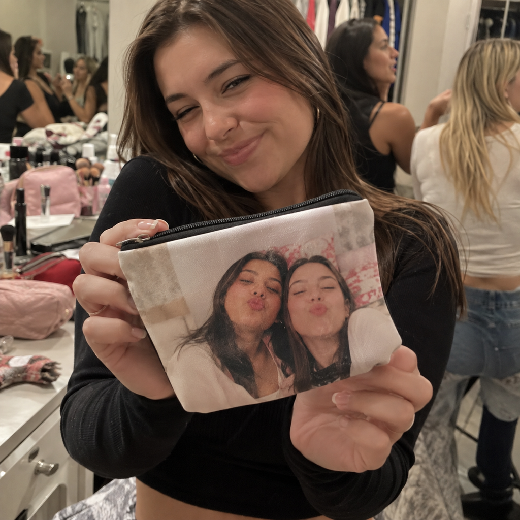 A zip pouch printed with two friends in a dressing room.