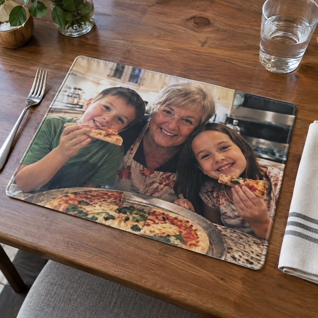 Placemat printed with a grandmother and children making pizza.