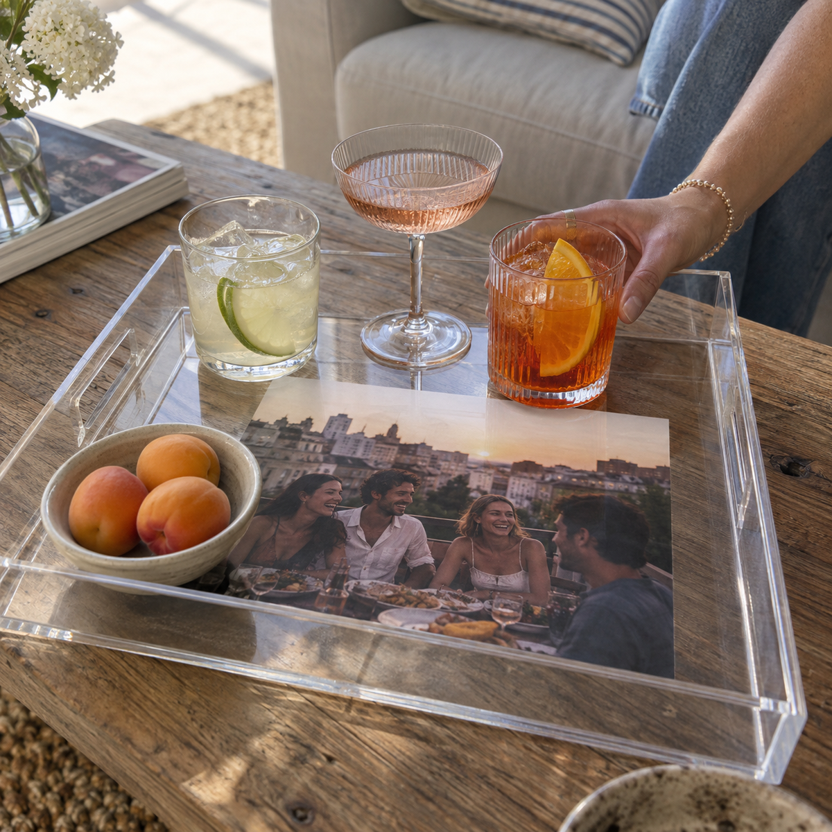 Clear acrylic serving tray with a photo of friends at a previous dinner.