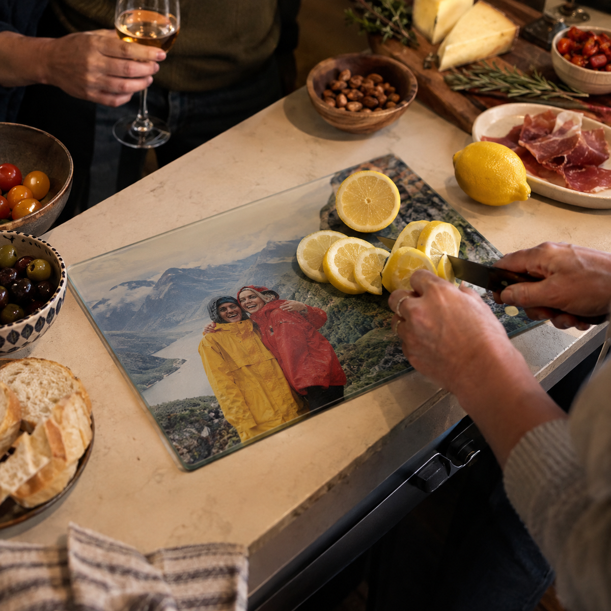 Glass cutting board with a mountain hike photo beneath the glass.