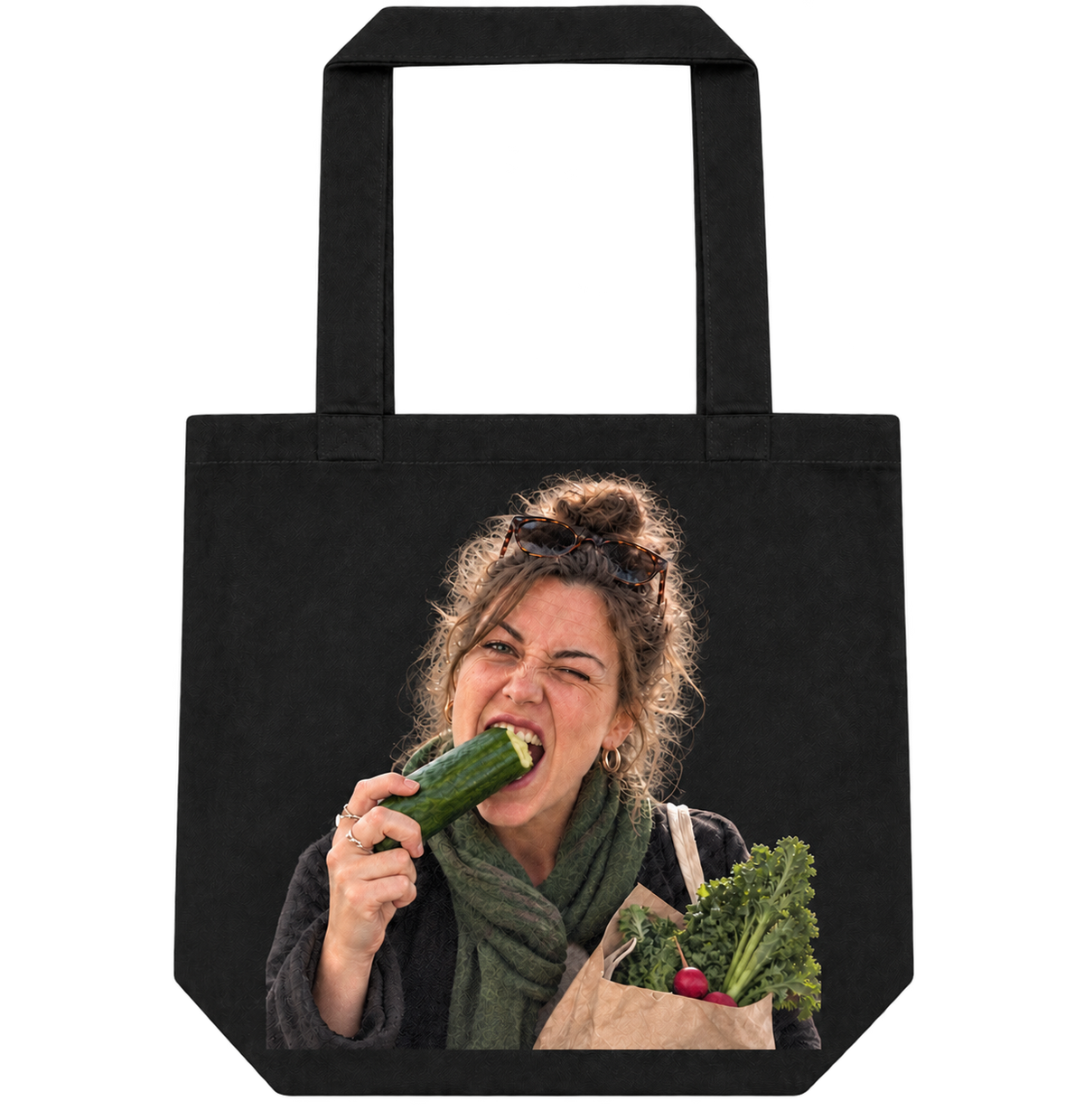 Black personalized tote bag printed with a funny photo of a woman biting a cucumber.